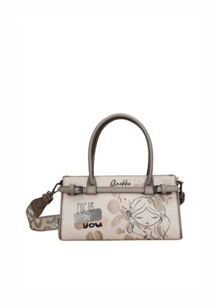 Borsa rettangolare beige con manici marroni, scritta "Focus on you" e disegno di una ragazza che tiene una candela accesa sul davanti.