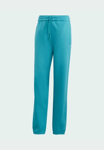 Teal sweatpants med elastisk talje, justerbar snøre, sidelommer og elastiske manchetter på en lys baggrund.