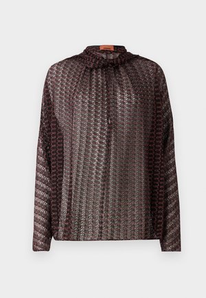 Patterned blouse featuring a high neckline, long sleeves, and a tie closure. Material has a textured, shiny finish with dark red and silver tones.