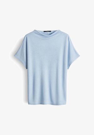 T-shirt bleu clair à manches courtes avec col rond, coupe ample et texture côtelée subtile, présenté sur un fond blanc.