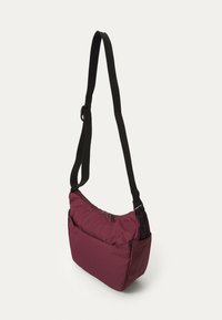 Burgundy shoulder bag with a textured fabric, featuring a zippered top and adjustable black strap. Includes a front pocket for storage.