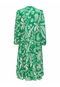 Abito floreale verde con maniche lunghe, design a strati, stampe botaniche bianche e scollatura a girocollo. Realizzato in tessuto leggero.