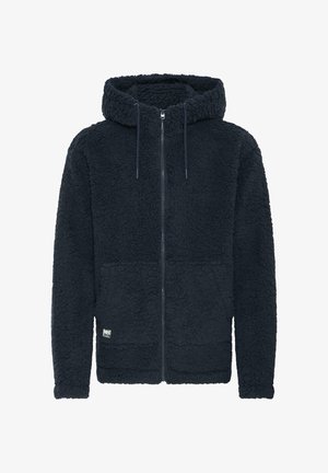 Tamnoplava flis dukserica s teksturiranim materijalom, puni zip sprijeda i podesivim vezicama na kapuljači. Sadrži mali logo branda na rubu.