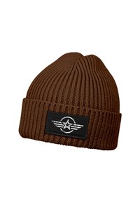 Brown knit beanie with a textured ribbed design, featuring a black patch with a white star and wing graphic.