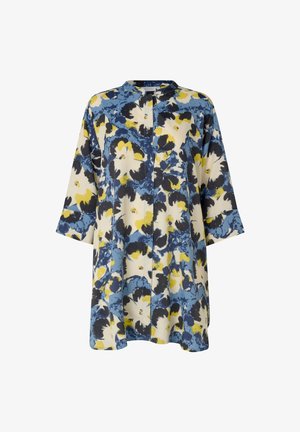 Tunika floreale con motivo astratto di fiori blu, gialli, neri e bianchi, maniche lunghe e un colletto alla francese con dettaglio di piega frontale.