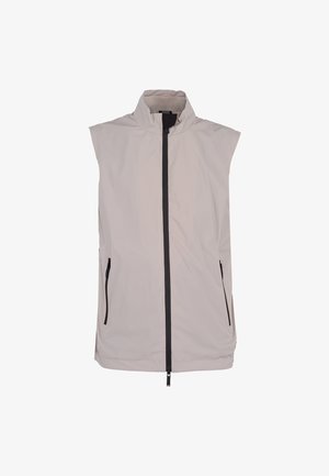 Mouwloos lichtbeige vest met hoge kraag, zwarte volledige ritssluiting aan de voorkant en zwarte ritssluiting-zijzakken op een witte achtergrond.