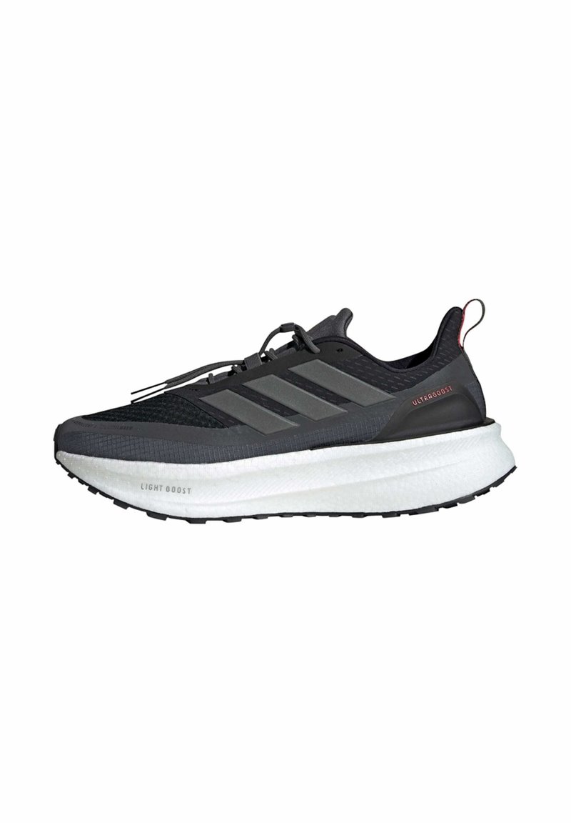 Black athletic shoe with a textured mesh upper, three gray stripes, white cushioned midsole, and black rubber outsole. Features a red accent on the heel.