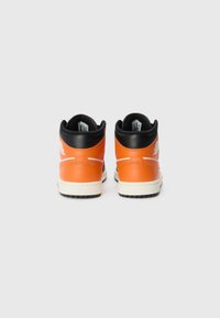 High-top sneakers with orange leather uppers, black accents, and a white midsole. Features a logo on the heel and textured rubber outsole.