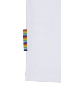 White cotton t-shirt with a side label featuring horizontal rainbow stripes and a purple edge. Smooth texture, classic shape.