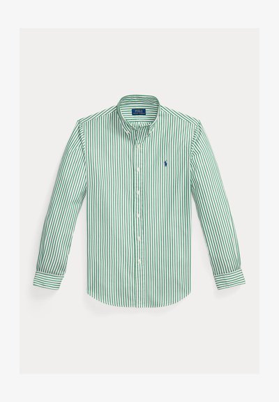 Chemise à manches longues boutonnée avec des rayures verticales vertes et un petit logo Polo Ralph Lauren bleu brodé sur la poitrine gauche.