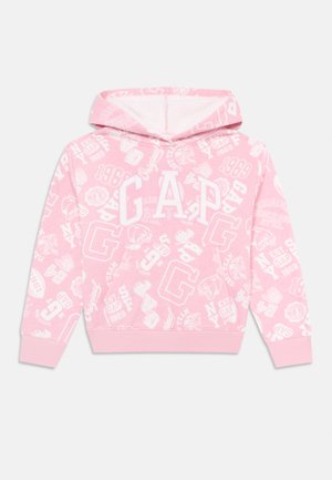 Sweatshirt à capuche rose avec le logo blanc GAP et divers motifs de logos et de textes sur le thème du sport.