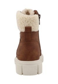 Brun faux læder ankelstøvle med hvid fleecekrave, lynlåslukning og struktureret gummisål. Har et trækstrop bagpå.