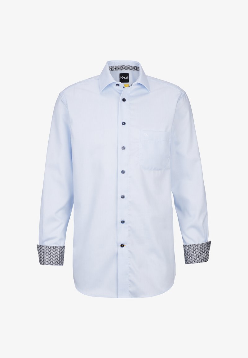 Camicia azzurro chiaro a maniche lunghe con una piccola tasca, dettagli scuri dei bottoni e polsini scuri a fantasia. Realizzata in tessuto morbido con un design colletto.