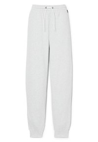Pantalon de survêtement gris clair en tissu doux, avec une taille élastique à cordons de serrage, des jambes fuselées et des poignets côtelés aux chevilles.