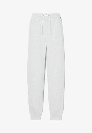 Light gray sweatpants made of soft fabric, featuring an elastic waistband with drawstrings, tapered legs, and ribbed cuffs at the ankles.