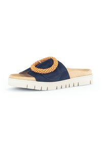 Navy blue suede slide sandal with open toe, featuring a circular orange bead accent and a textured white platform sole.