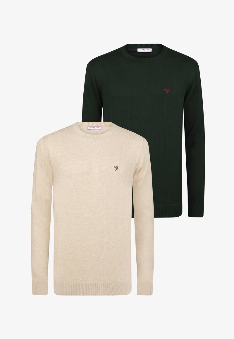 Due maglioni a manica lunga con scollo rotondo, uno beige e uno verde scuro, ciascuno con un piccolo logo a forma di uccello sul petto a sinistra.