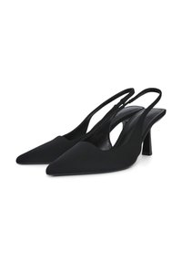 Escarpins slingbacks noirs à bout pointu, confectionnés en matière lisse. Dotés d'un talon fin et de côtés ouverts pour la ventilation.
