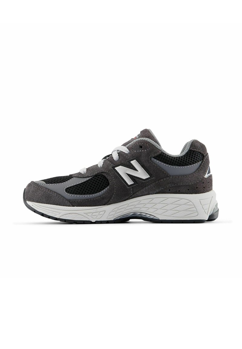 Gray athletic shoe featuring a mesh upper with suede accents, white logo, and textured rubber sole for grip. Classic lace closure.