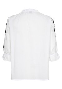 Blouse blanche à manches trois-quarts bouffantes avec broderie florale noire et poignets à volants, vue de dos.