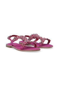 Roze sandalen met een suede afwerking, voorzien van decoratieve bloemversieringen en strasssteentjes. Platte zool met verstelbare enkelband.
