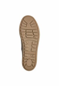 Schuhsohle aus beigem Gummi mit strukturiertem Griff, ausgestattet mit Flex-Zonen und einem runden Akzent. Kennzeichnungen umfassen "soft" und "FLEX."