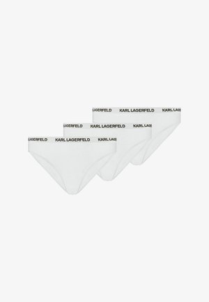 Trois slips blancs avec le logo noir "KARL LAGERFELD" imprimé en répétition sur la ceinture élastique, sur fond blanc.