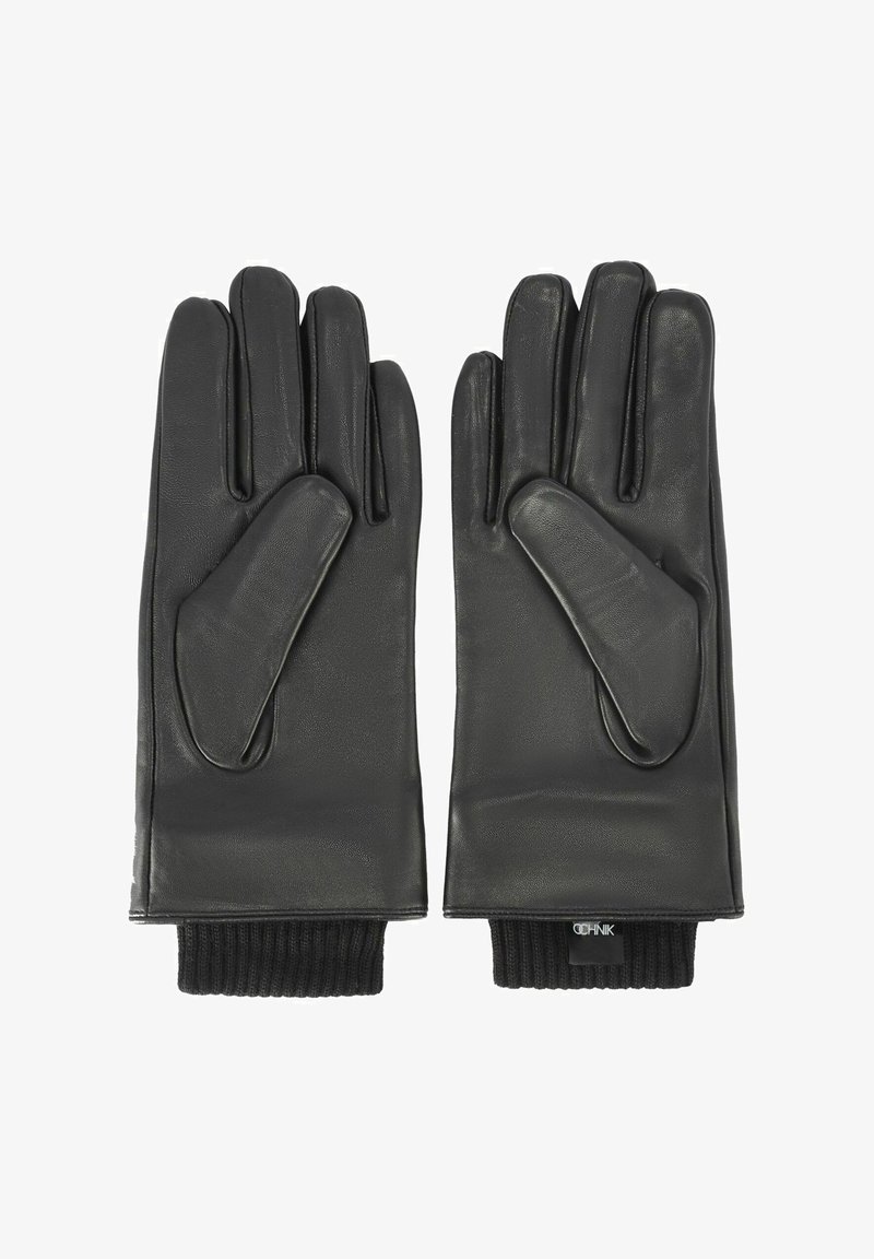 Czarne skórzane rękawiczki z prążkowanymi, dzianinowymi mankietami. Gładka faktura, pięciopalczasty krój oraz lekko wydłużona część dłoniowa dla komfortu.