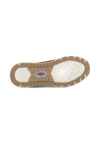 Schoenenzool van rubbermateriaal, met een gestructureerd loopvlakpatroon, lichtbeige kleur en een logo in het midden. De vorm is rond.