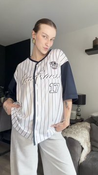 White pinstriped baseball jersey with navy sleeves, featuring “San Francisco” embroidered in script and number “17” on the front.