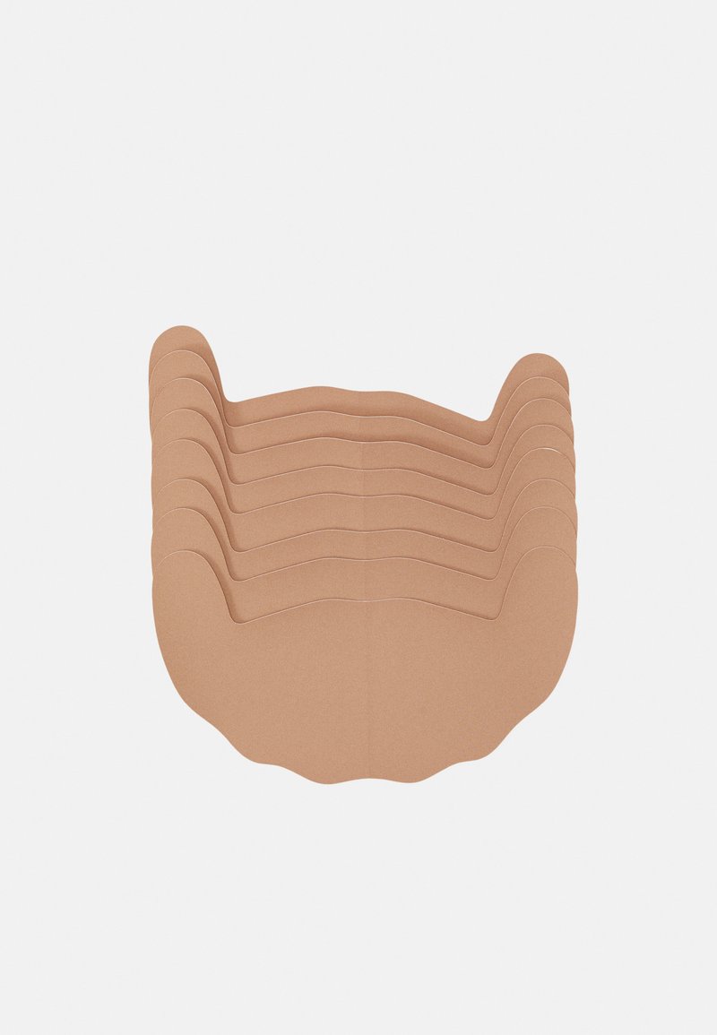 Pile de huit sous-verres en papier beige à bord festonné, présentant une texture lisse et une forme uniforme, idéaux pour un usage décoratif ou pour le dressage de la table.