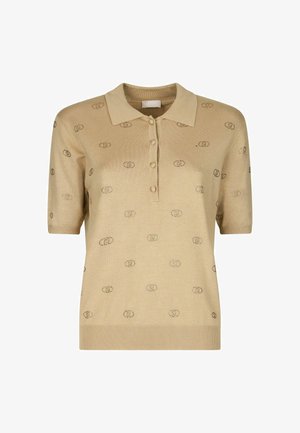 Polo shirt beige in maglia con maniche corte, tre bottoni e dettagli a motivo di design circolari in tutta la parte. Texture liscia.