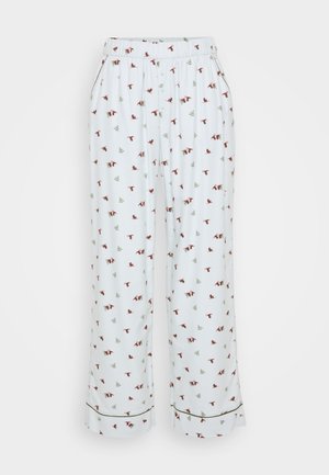 Pantaloni del pigiama bianchi con un motivo ripetuto di uccelli rossi e alberi verdi. Vita elastica, design a gamba larga, con piping nero sui orli.
