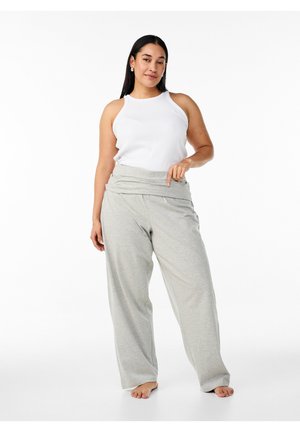 Light gray, loose-fitting sweatpants with a foldover waistband, paired with a white ribbed tank top. Soft cotton material, casual style.
