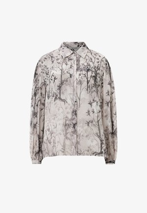 Blusa leggera e trasparente in beige con stampa botanica. Presenta un colletto e maniche lunghe elasticizzate.