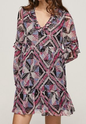 Long-sleeve dress with a V-neck, ruffled collar and hem, featuring a colorful patchwork pattern in shades of pink, black, white, and blue.