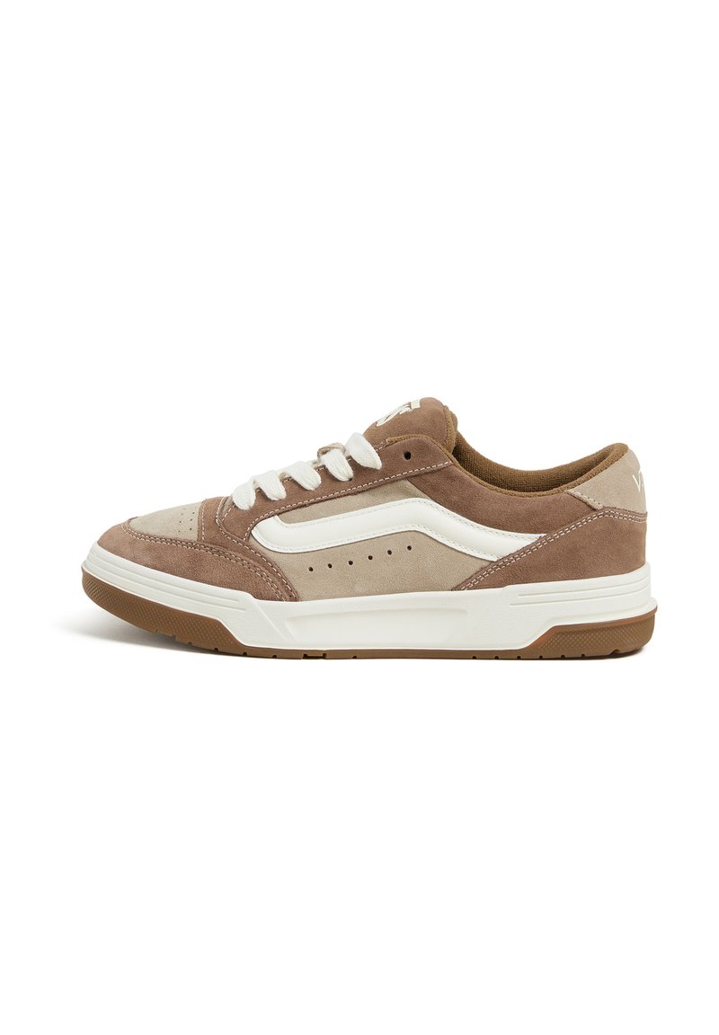 Brown and beige suede sneaker with a white textured side stripe, round toe, padded collar, and white laces. Rubber sole with traction pattern.