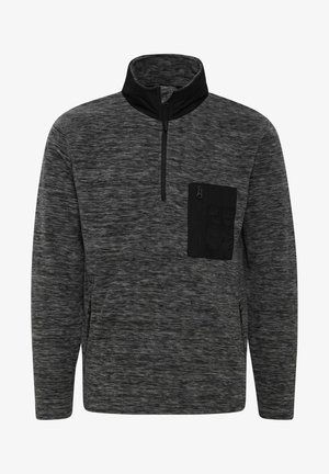 Szürke, negyed cipzáras pulóver textúrált anyagból, fekete cipzáras zsebbel és fekete gallér részletekkel. Oldalsó varrással ellátott zsebek is találhatók.