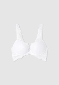 Reggiseno bianco in pizzo con ferretto, coppe imbottite e spalline decorative a scallop. Presenta un design incrociato sul retro per un tocco di dettaglio in più.