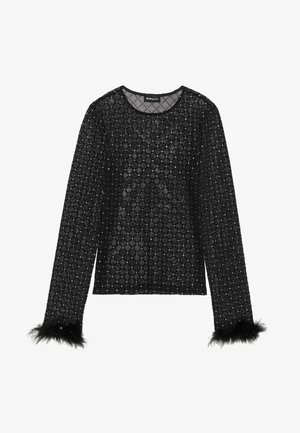 Haut noir à manches longues en tissu transparent à motifs en losange, avec de petites paillettes scintillantes et des poignets plumés.