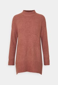 Stickad polotröja i dammig ros, med ett texturerat mönster, långa ärmar och en något längre bakhel.