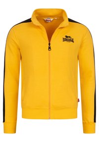 Žltá bunda na zips s čiernymi bočnými akcentmi, s vysokým golierom a logom na hrudi. Mäkká tkanina s rebrovanými manžetami a lemom.