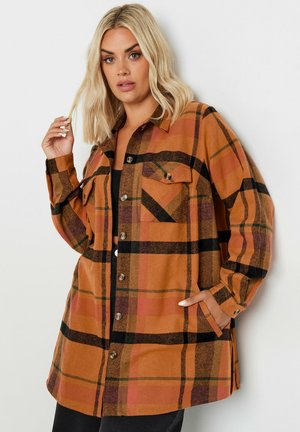 Brown plaid shirt jacket with black and orange accents, button closure, two front pockets, and a relaxed fit, made of soft fabric.