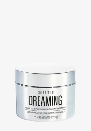 Zilverkleurige pot met label Color Wow Dreaming geavanceerde reparatie en herbehandeling, 215 ml, met een reflecterend deksel op een witte achtergrond.