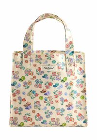 Borsa a spalla in tela crema con motivo floreale, decorata con fiori e foglie colorate, dotata di due manici robusti e un'etichetta con logo.