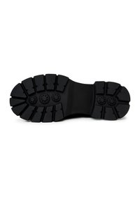 Zwarte rubberen schoenzool met een robuust profiel en verheven secties voor grip, en drie ronde accenten in het midden.