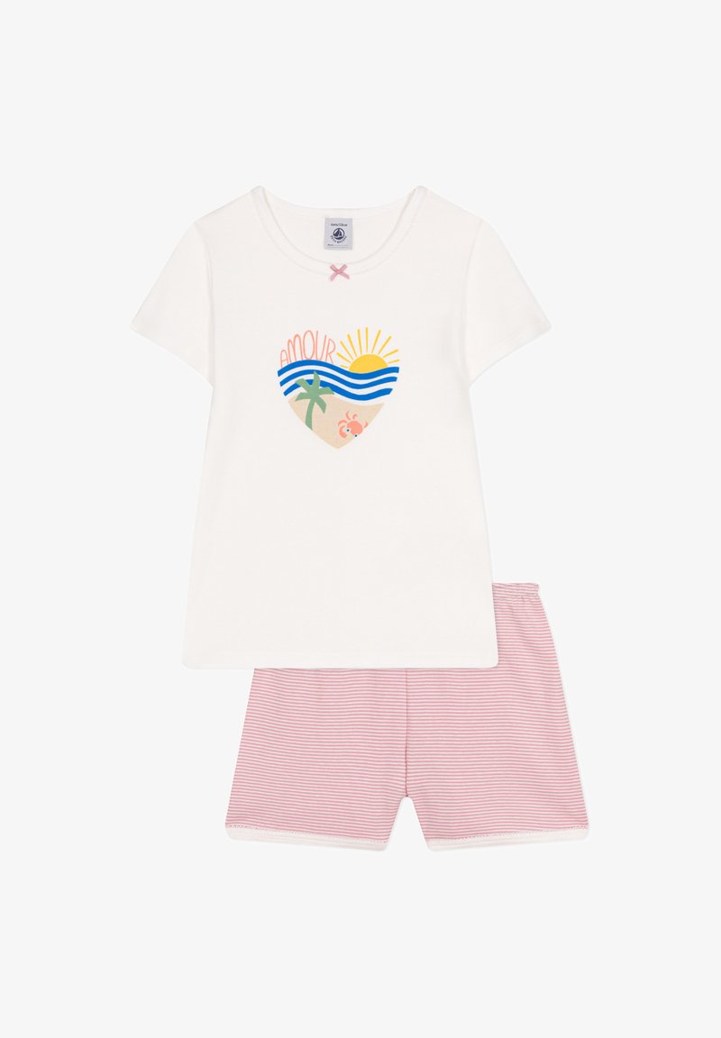 White short-sleeve T-shirt with a heart-shaped beach graphic featuring waves, a palm tree, and a sun. Paired with pink striped shorts.