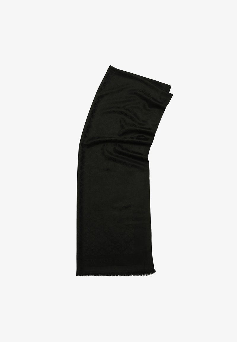 Sort rektangulær tørklæde lavet af et glat materiale med et subtilt geometrisk mønster og frynser i kanten, der har teksten "NEW YORK" i den ene ende.