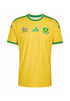 Geel Zuid-Afrikaans voetbalshirt met groene bies, Adidas-logo, embleem van de Zuid-Afrikaanse voetbalbond en het nationale teamwapen op de borst.