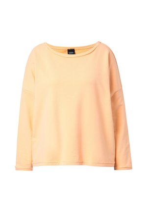 Vaalean persikanvärinen pitkähihaiset collegepaita, jossa on pyöreä pääntie ja rento istuvuus, esitetty valkoista taustaa vasten.